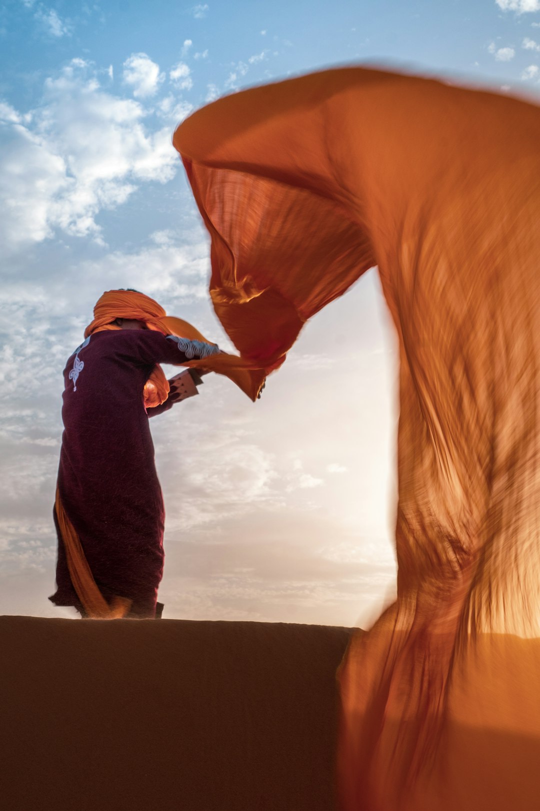 person's orange scarf