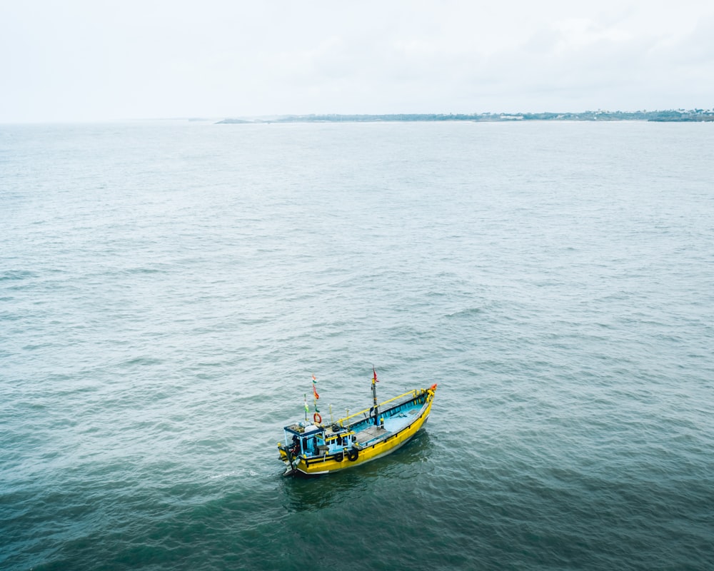 teal and yellow boat