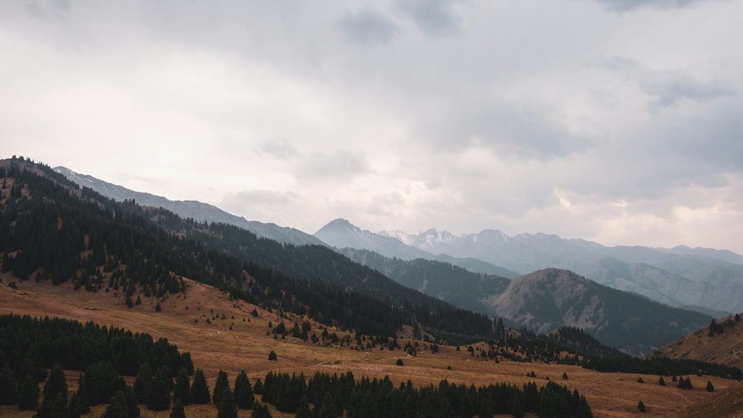 photography of mountain range during daytime in Almaty Region Kazakhstan