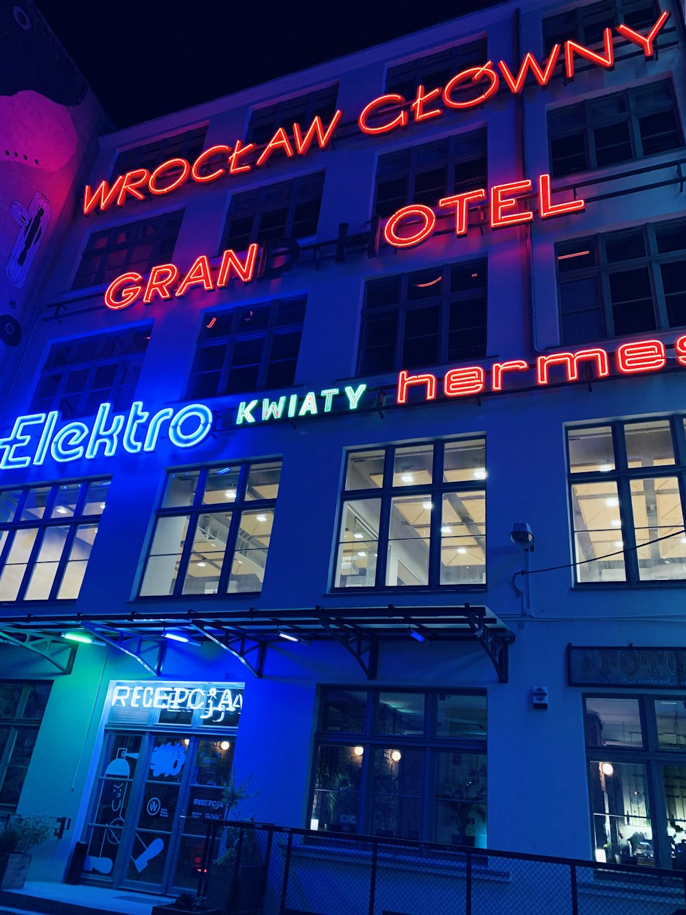 blue and red neon signage on building