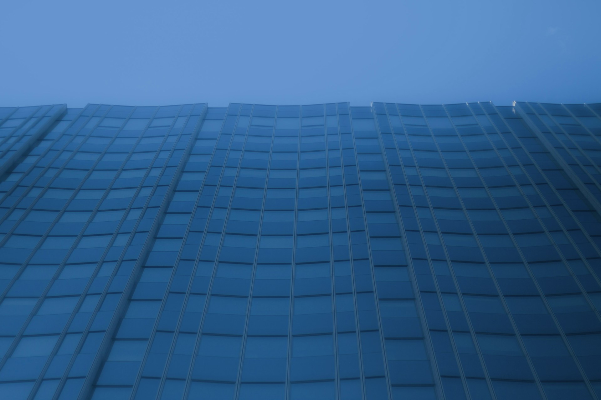 a very tall building with a clock on it's side