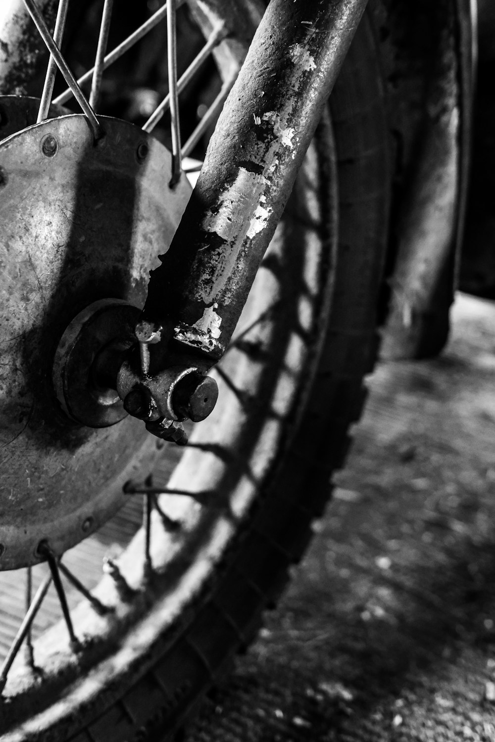 grayscale photo of motorcycle fork