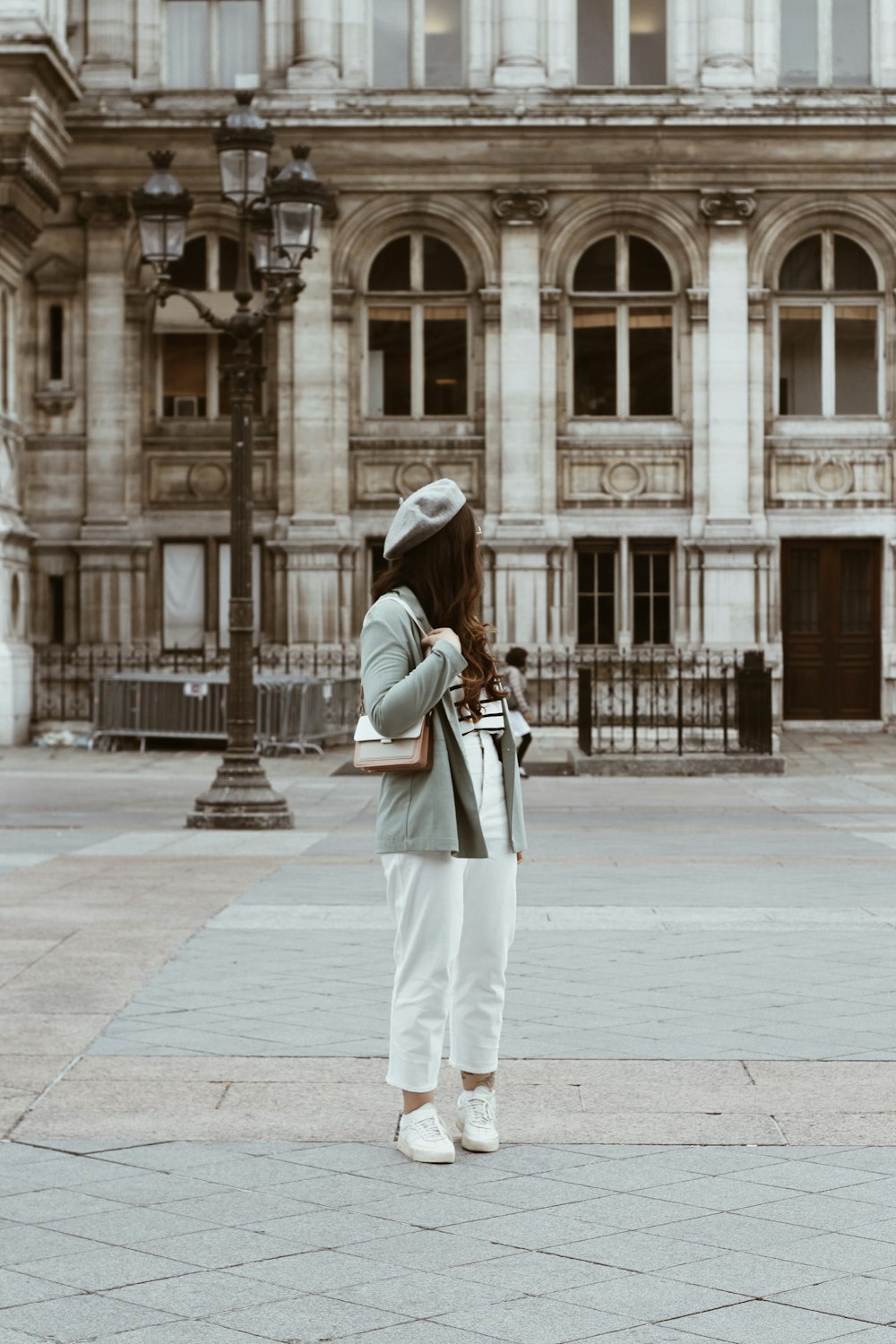 woman with a beret at a courtyard