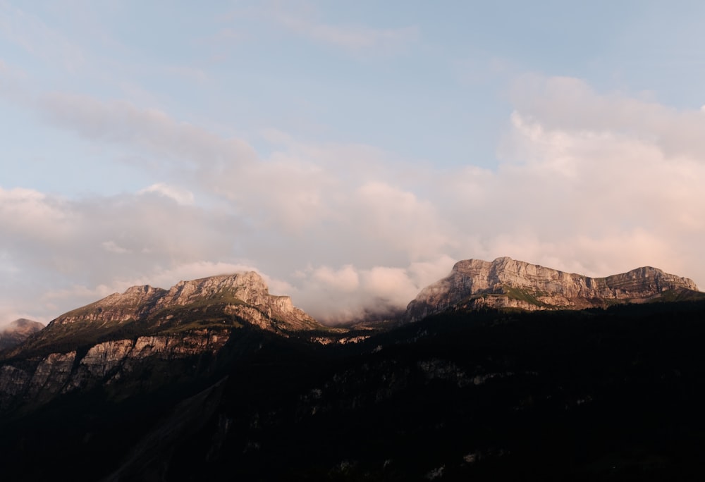 photo of mountain and clouds scenery