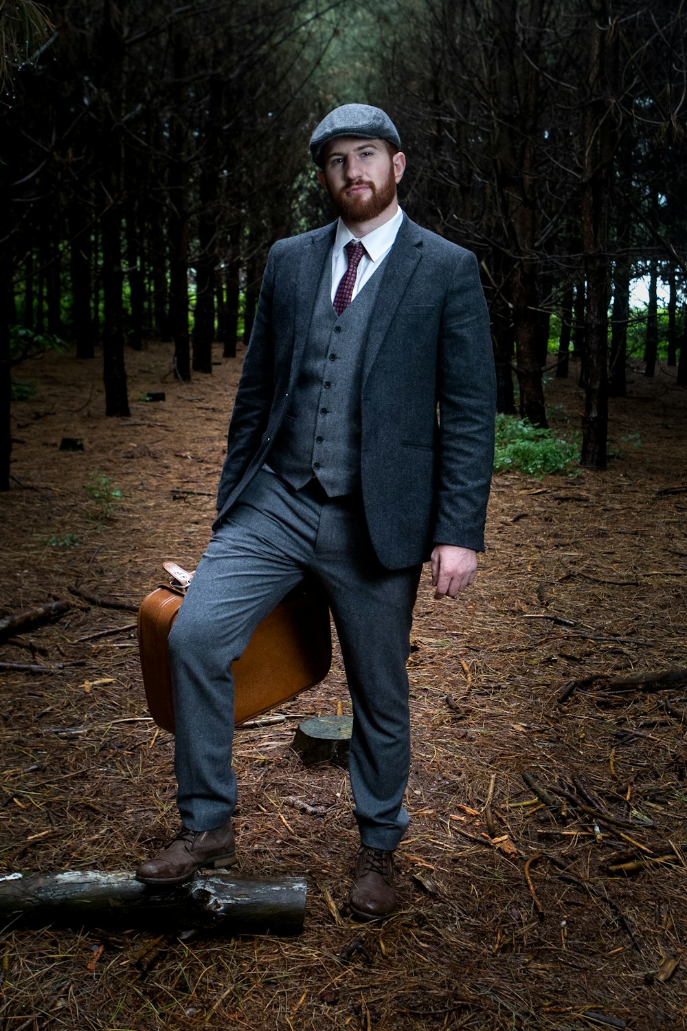 man in suit jacket carrying briefcase