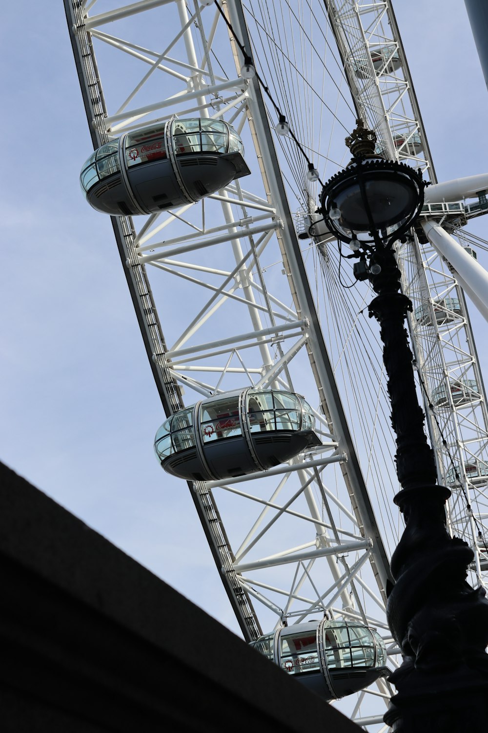 low-angle photo of white and grey Ferris wheel during daytime