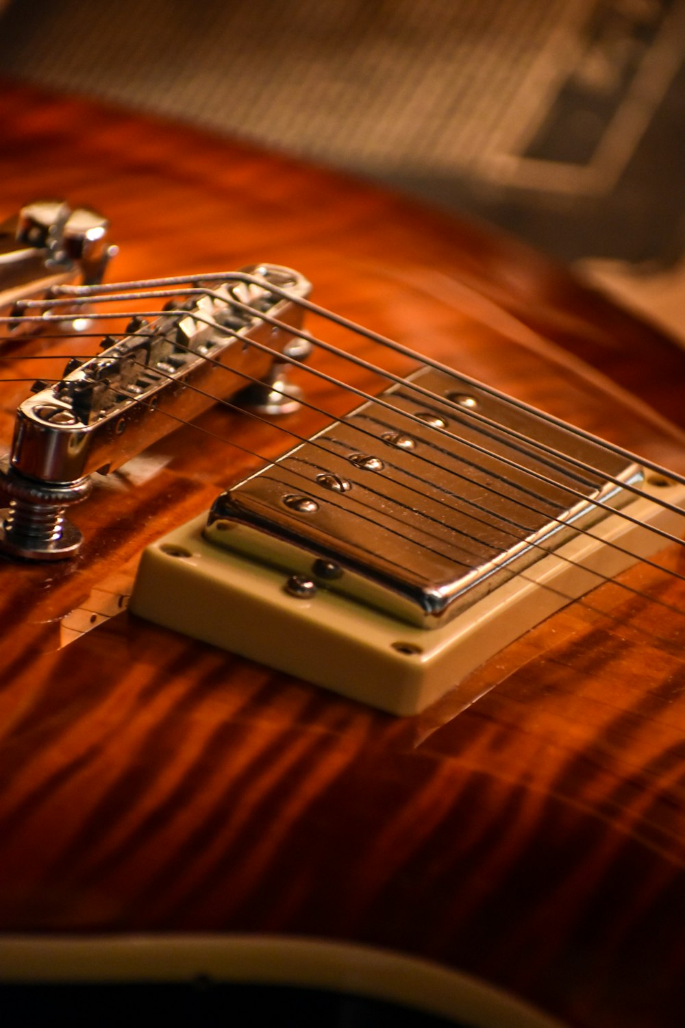 close-up photo of brown electric guitar