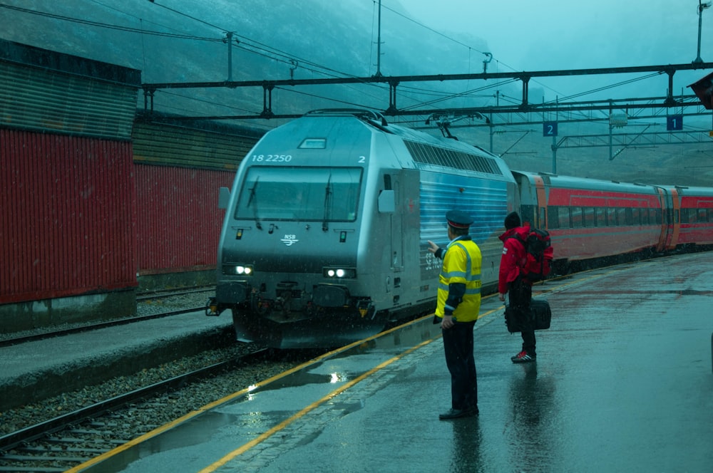 two men at a train station