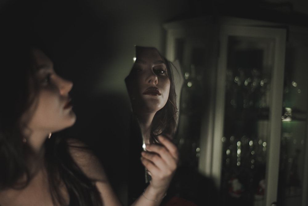 woman holding mirror