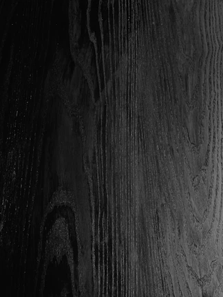 Walnut wood slab featuring deep chocolate hues and swirling grain.