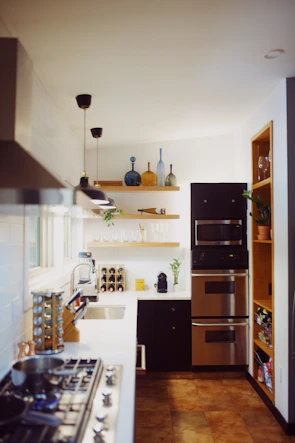 Modern kitchen fully equipped with appliances and utensils in the duplex.