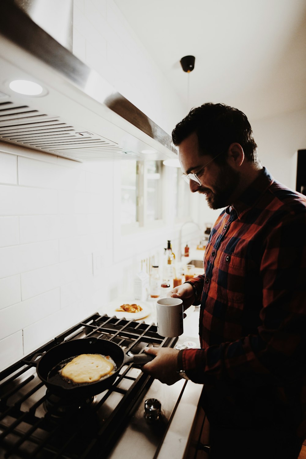 man standing beside range oven