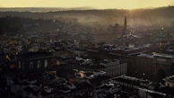 Concept art revealing the intricate design of the game's central city under dusk lighting.