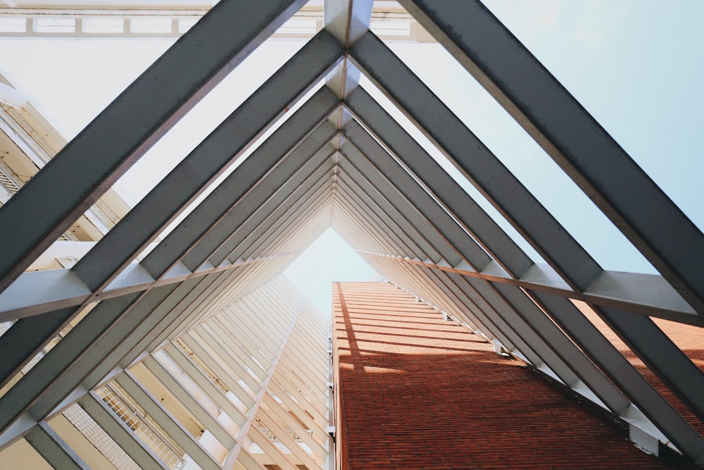 grey triangular structure with sunlight passing through