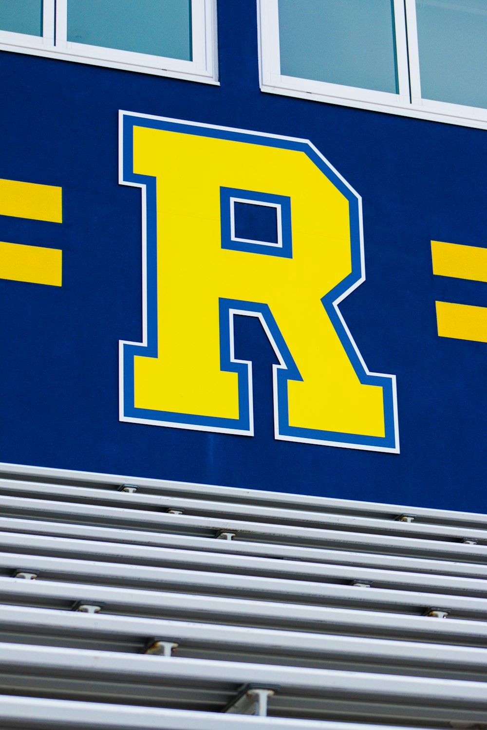 blue and yellow R sign
