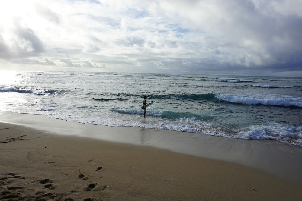 person standing on shore