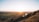 A serene landscape with a sunrise symbolizing hope and renewal.