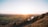 A serene landscape with a sunrise symbolizing hope and renewal.