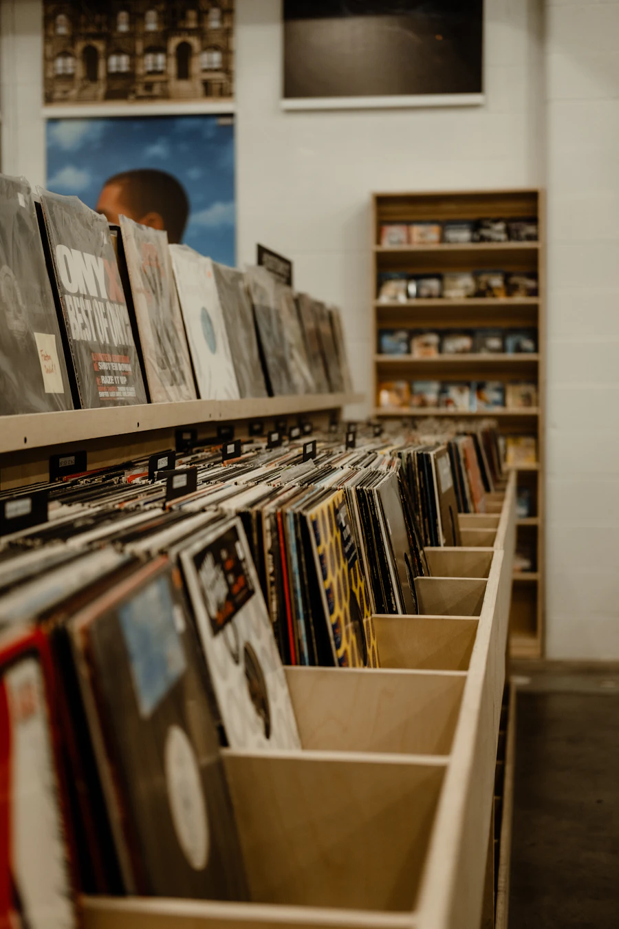 Wooden racks of vinyl records in a record shop