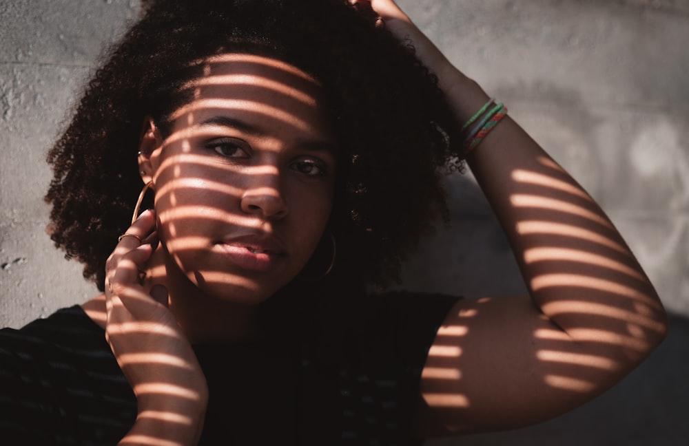 shadow of window on woman's face