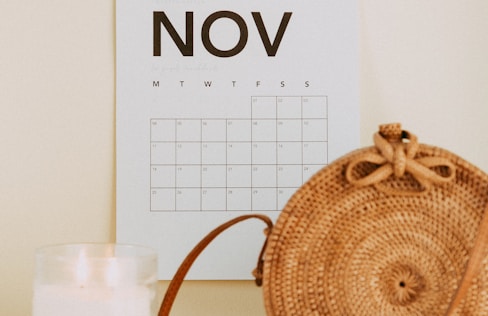 shallow focus photo of calendar mounted on white wall