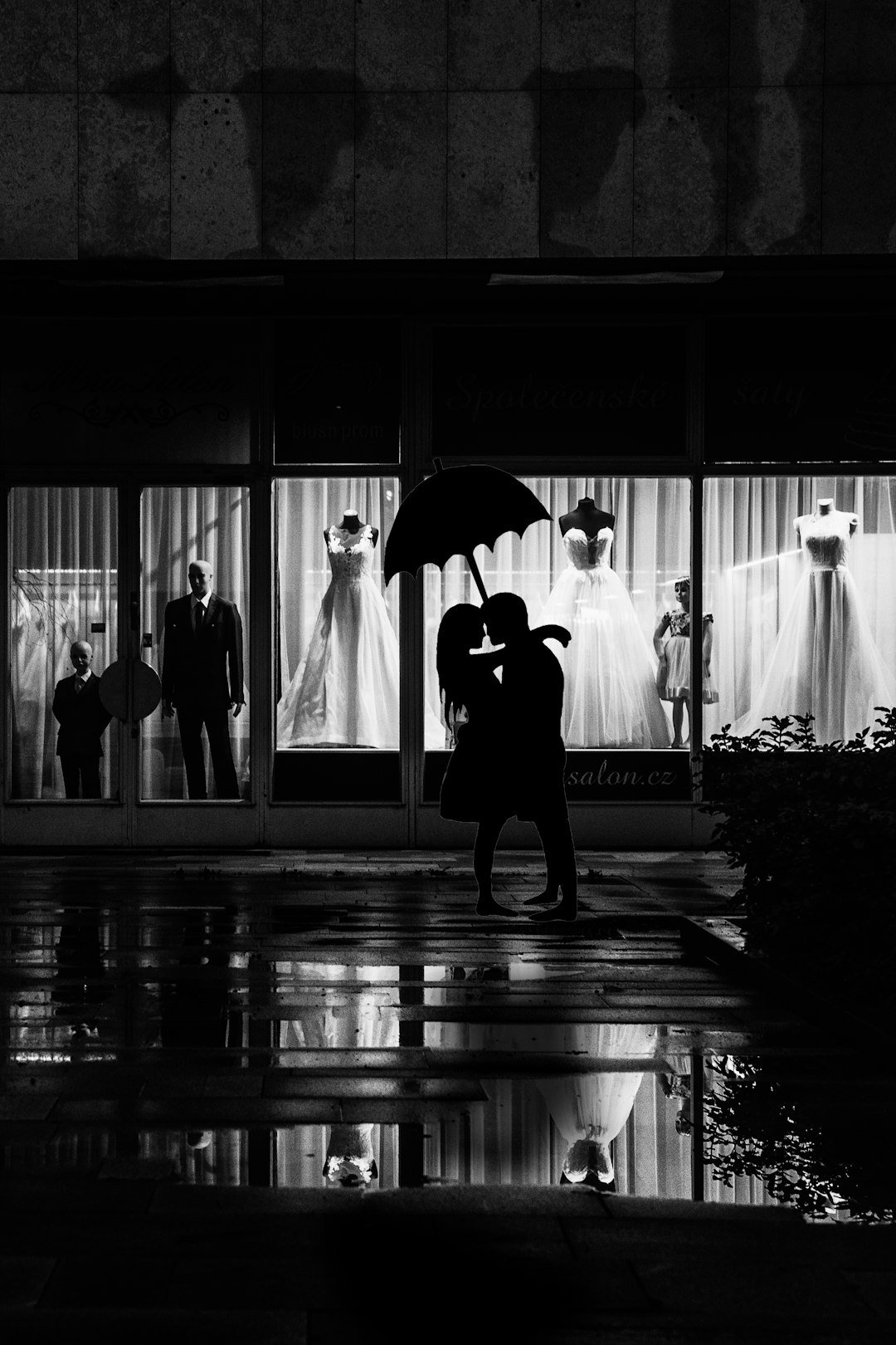 man and woman stands near store