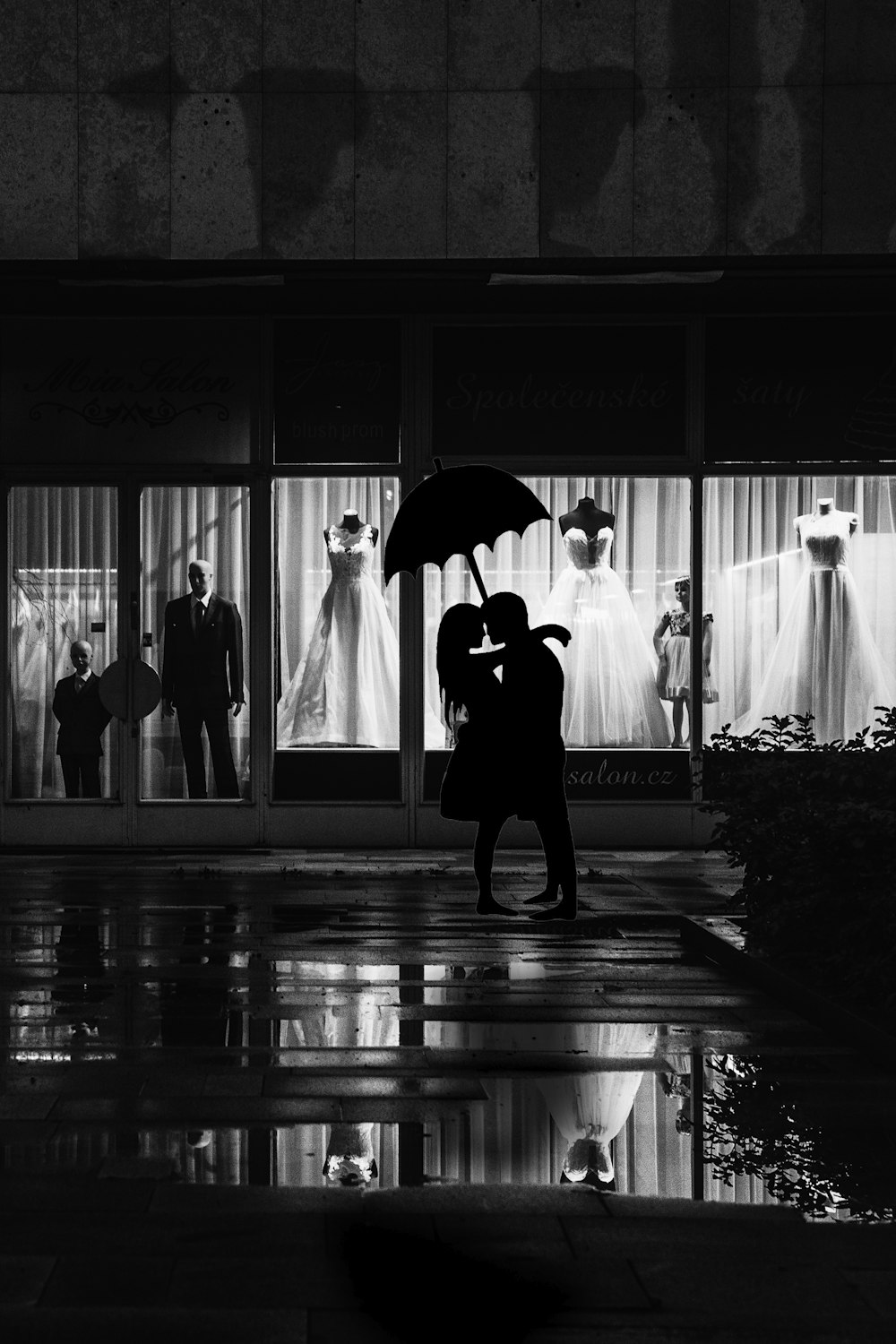 man and woman stands near store