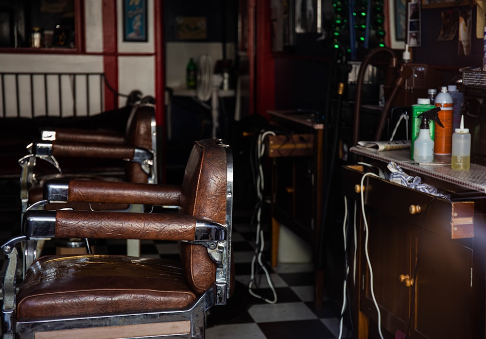 empty brown leather barber chairs