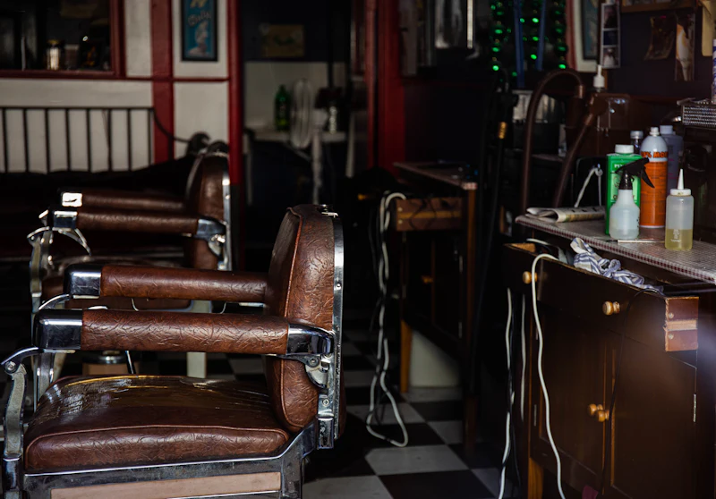 Brown leather barber chairs in a row