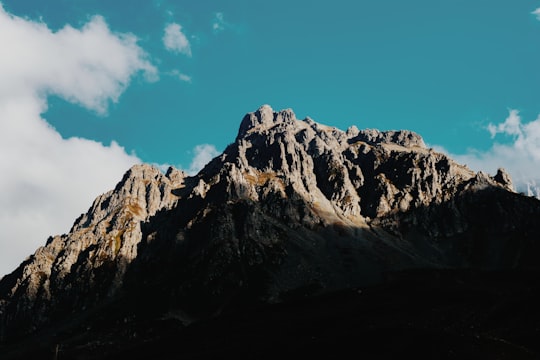 brown rock formation under white clouds in Rize Turkey