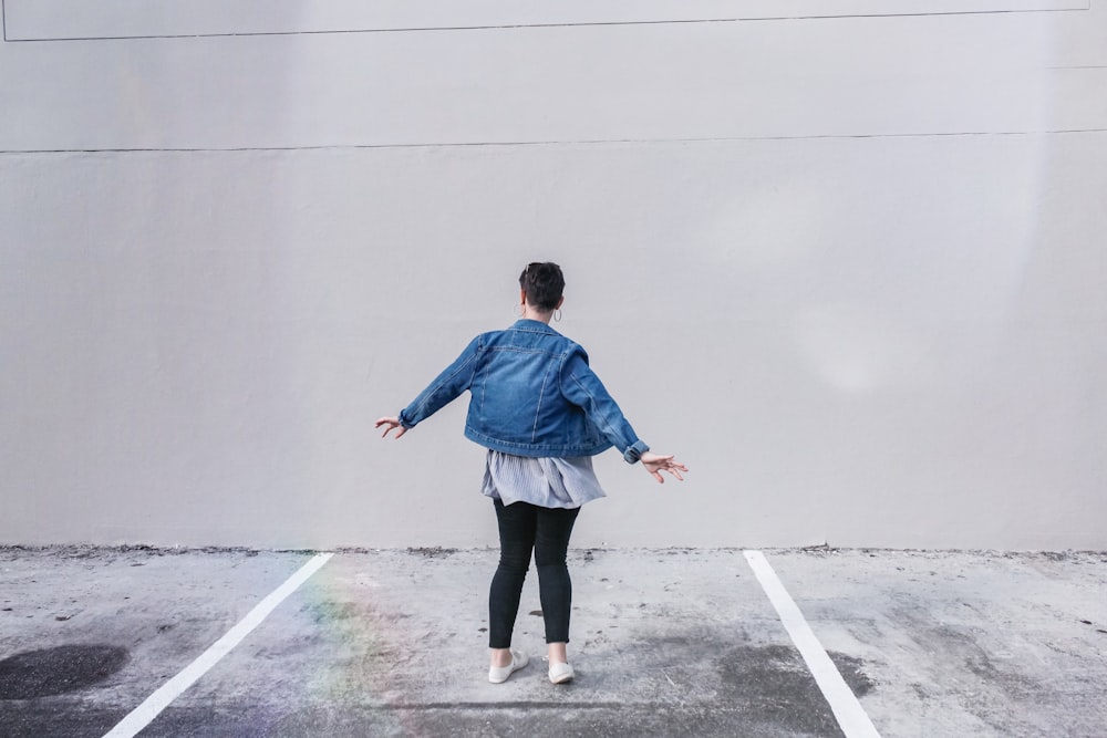 person wears blue denim jacket