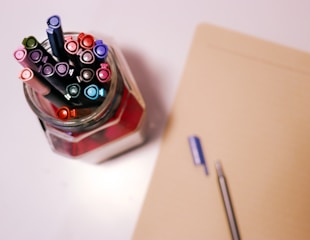 pens in glass container