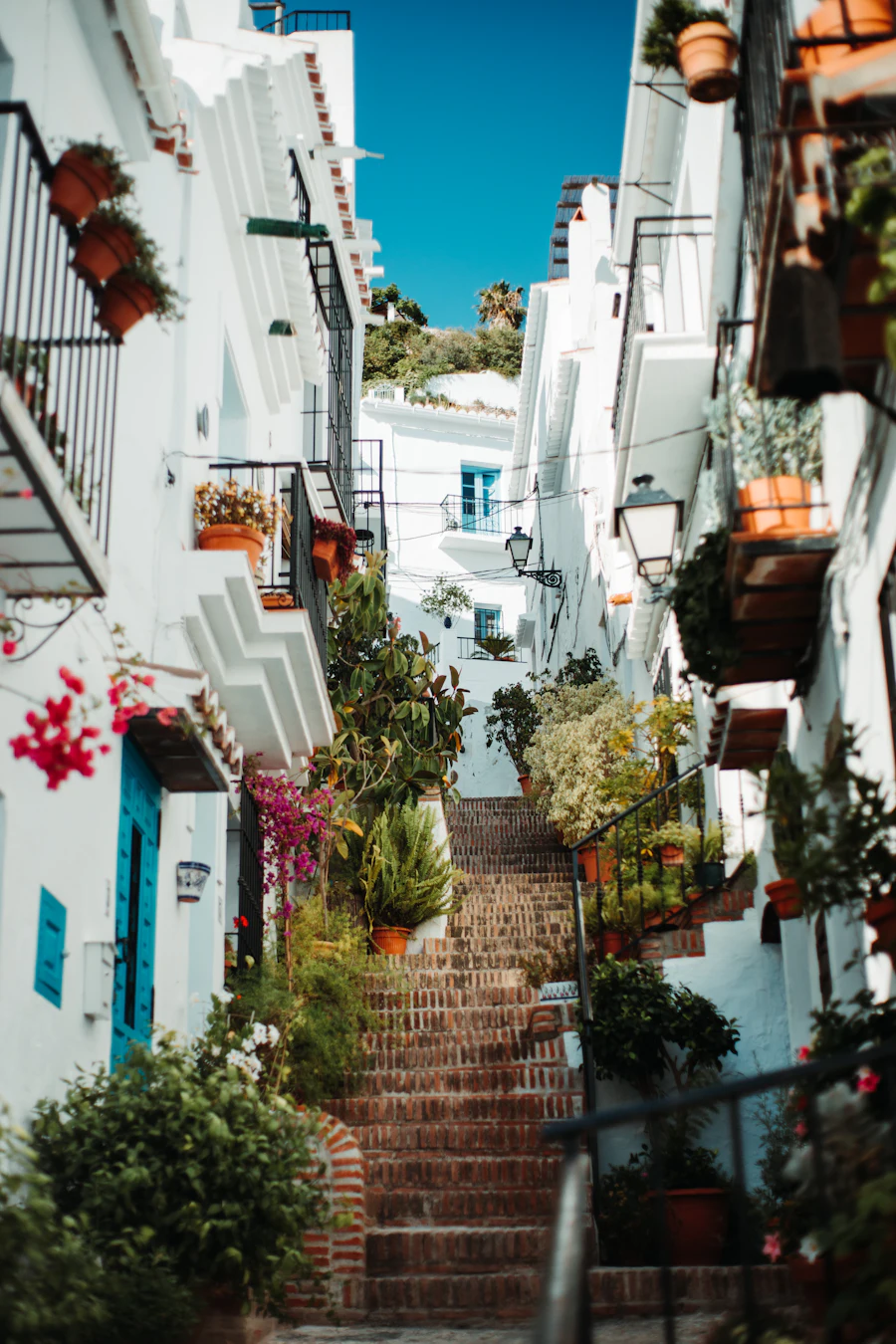 White hillside buildings framing a brown staircase