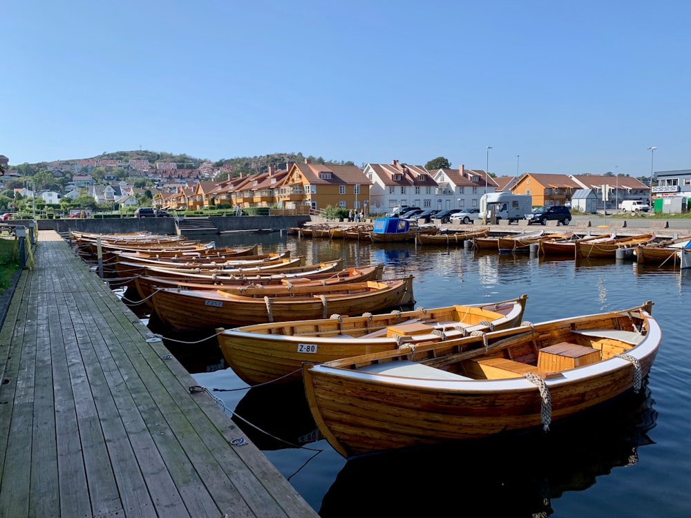 a row of boats sitting on top of a body of water