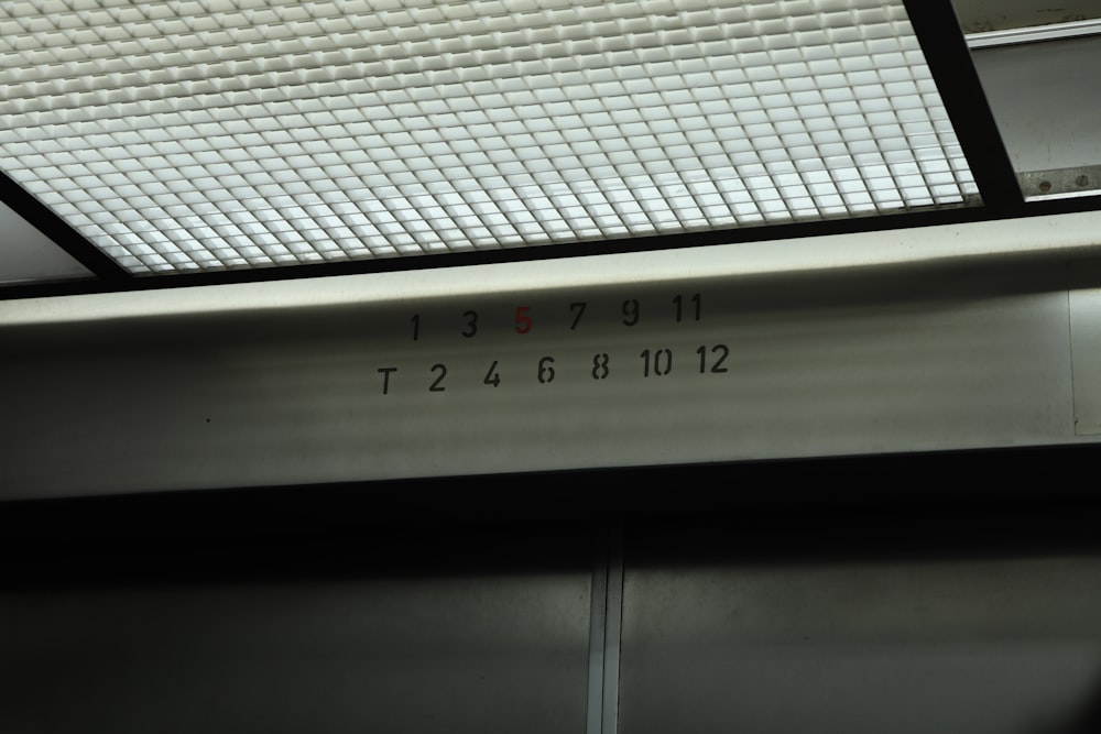 a close up of a metal door with numbers on it
