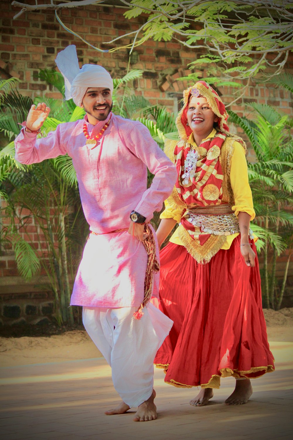 two man and woman standing and smiling