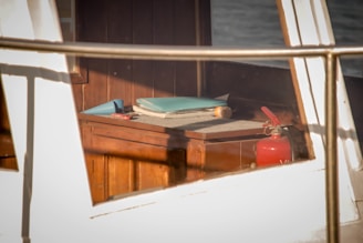 a book is sitting on a table on a boat
