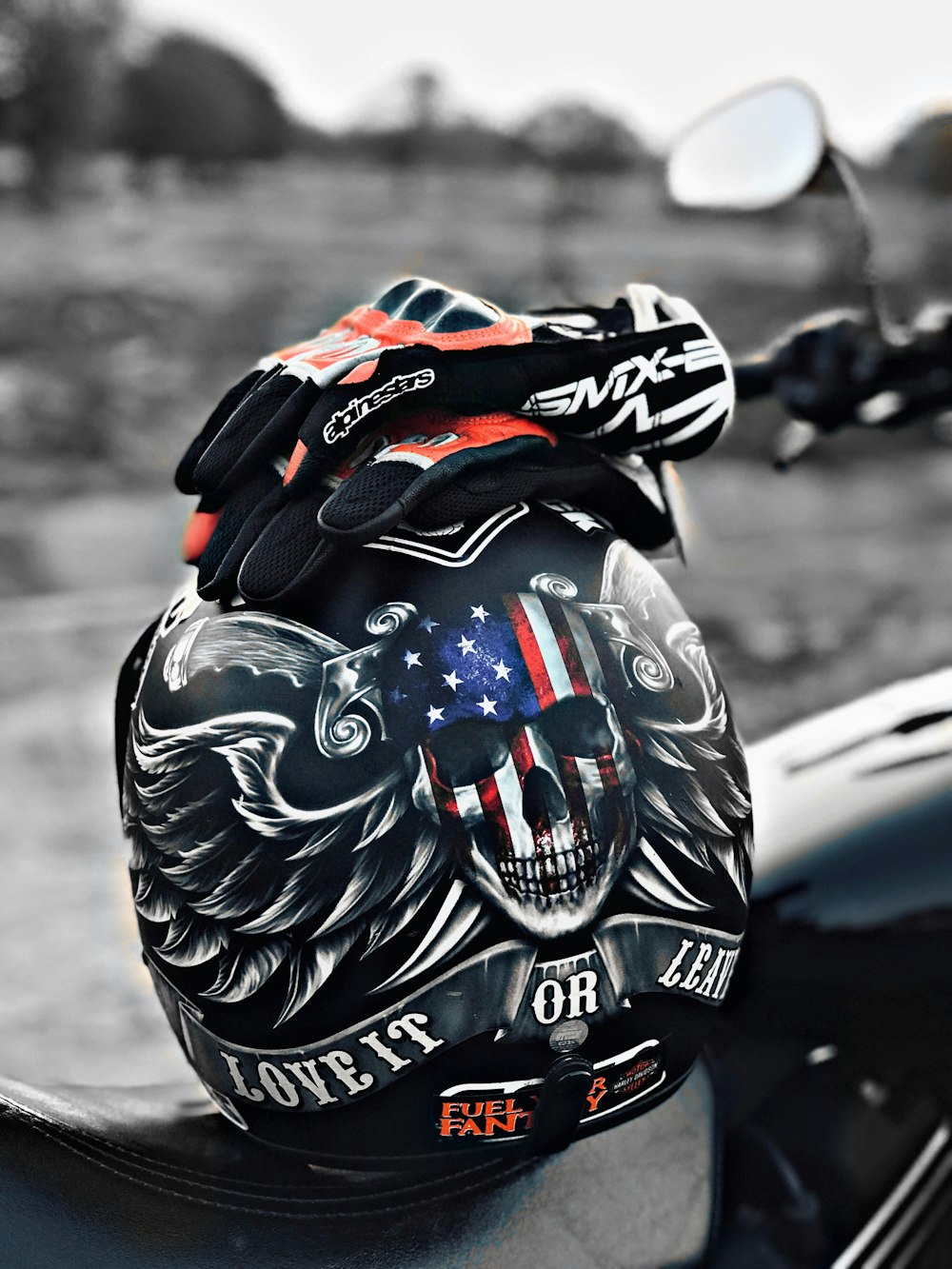 gloves on helmet on motorcycle