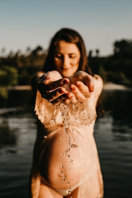 falling water from woman's hands