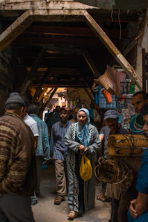 A local tour guide leading a group through a vibrant traditional market in Yogyakarta.