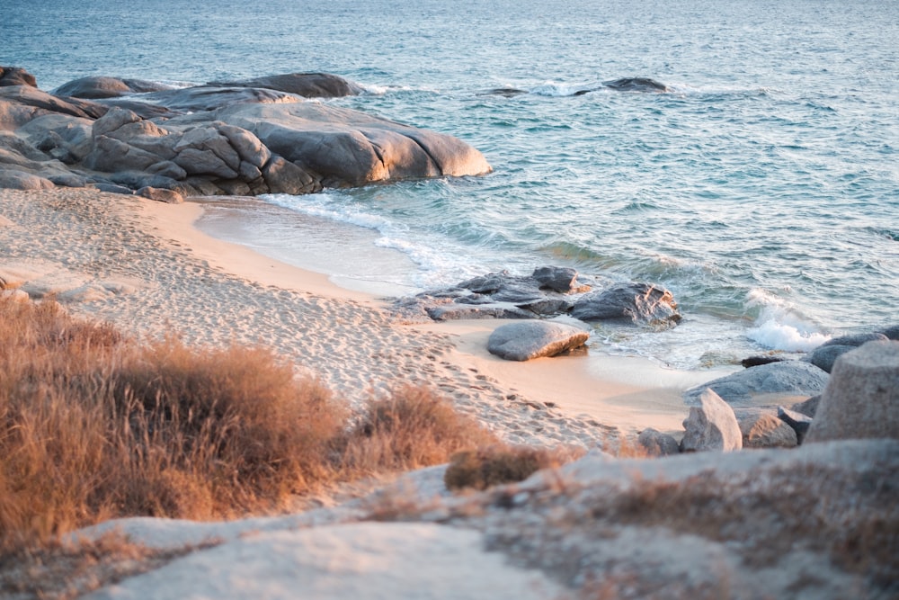 rock formations near body of water during daytime