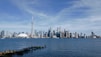 a large body of water with a city in the background