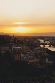 A peaceful sunset view over a European city skyline with iconic architecture.