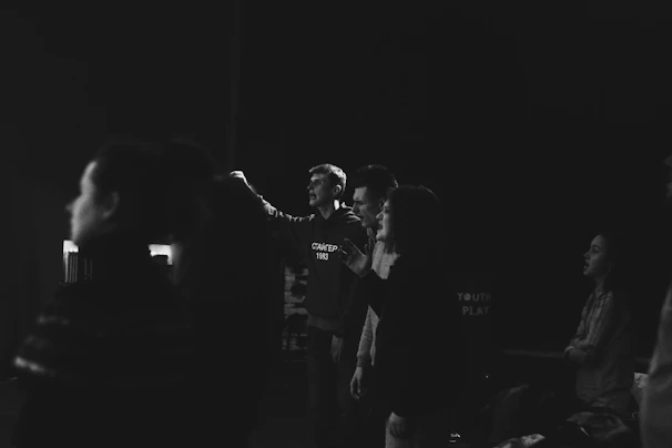 Participants engaging actively in a lively body language workshop with expressive gestures.