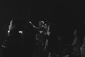 A group of deaf and blind individuals engaging in a lively rehabilitation session with supportive staff.