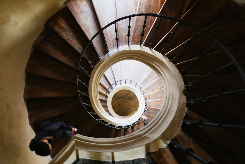 brown wooden spiral stairs with no people