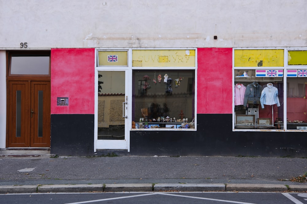 a store front with a red, yellow, and black color scheme
