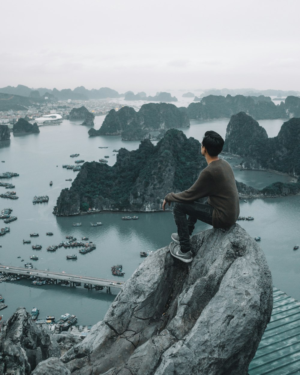 man sitting on cliff