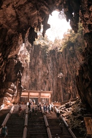 people at the stairs inside cave
