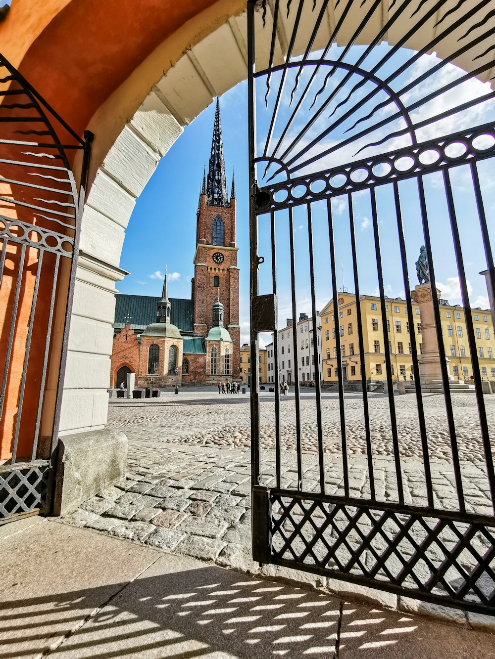 opened black metal arch gate